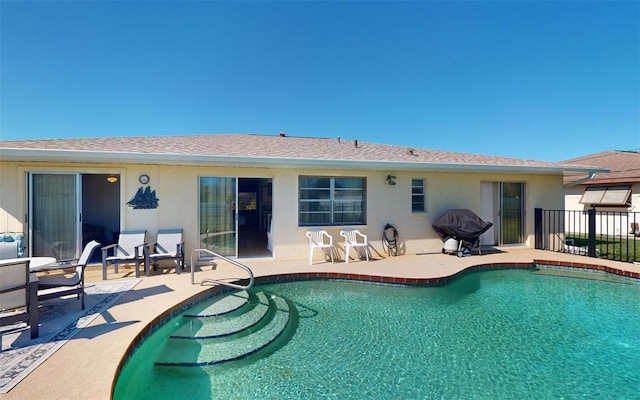 back of house with a patio