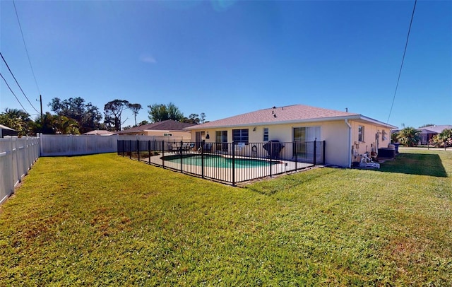 exterior space with a fenced in pool, a yard, and a patio