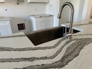 kitchen with white cabinetry