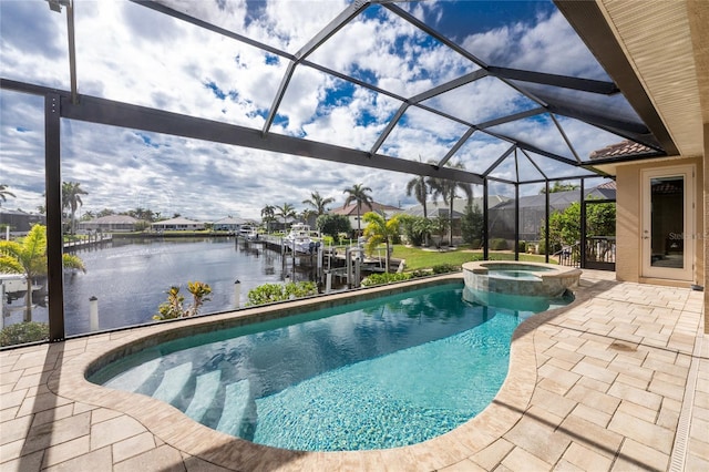 view of swimming pool featuring a lanai, a patio, an in ground hot tub, and a water view