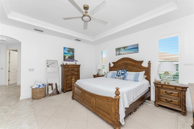 bedroom with ceiling fan and crown molding