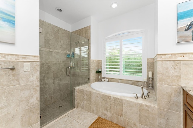 bathroom with vanity, plus walk in shower, and tile patterned floors