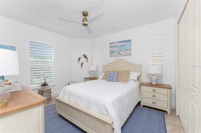 bedroom featuring ceiling fan and a closet