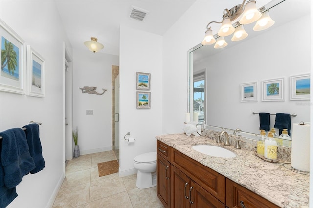 bathroom featuring tile patterned flooring, an enclosed shower, vanity, and toilet