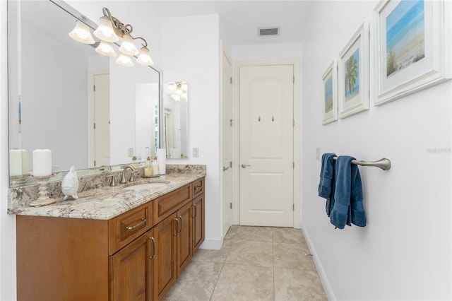 bathroom with tile patterned flooring and vanity