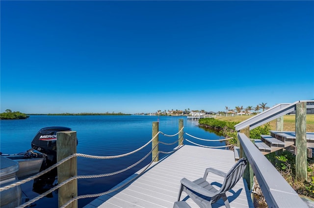 dock area featuring a water view