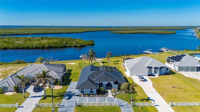 birds eye view of property with a water view