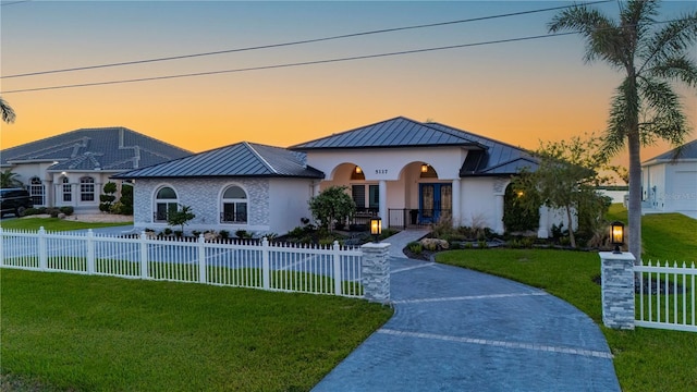 view of front of property with a yard