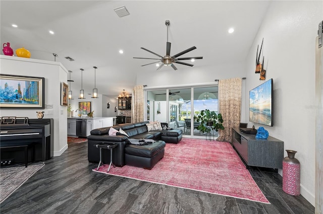 living room featuring ceiling fan, bar area, and dark hardwood / wood-style flooring