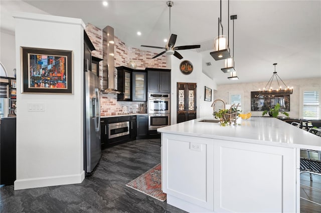 kitchen featuring appliances with stainless steel finishes, a kitchen bar, sink, backsplash, and a large island