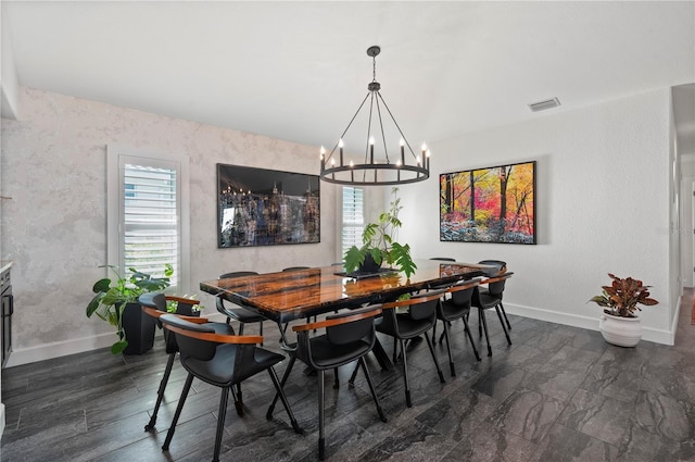 dining space featuring a chandelier