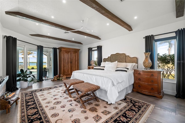 bedroom featuring access to outside, beam ceiling, and ceiling fan