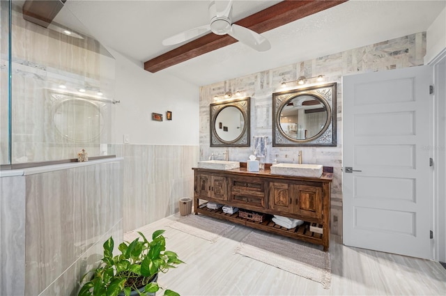 bathroom featuring ceiling fan, tile walls, vanity, and beamed ceiling