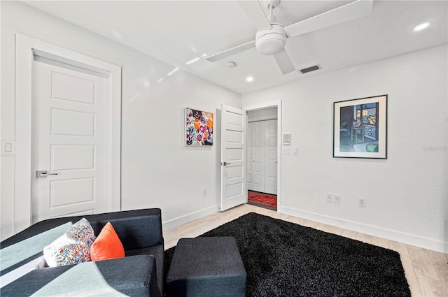 bedroom featuring ceiling fan, a closet, and light hardwood / wood-style floors