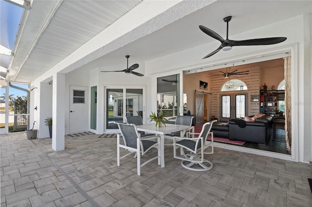 view of patio with ceiling fan and french doors