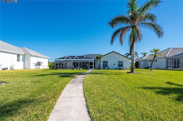 view of front of property with a lanai and a front lawn