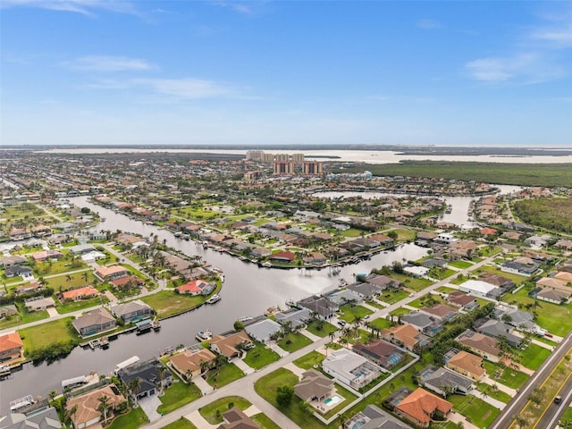 bird's eye view with a residential view and a water view