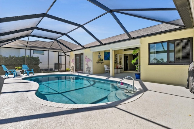 outdoor pool with a patio and a lanai