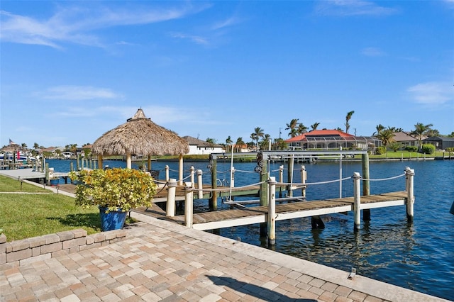 dock area with a gazebo, a water view, and boat lift