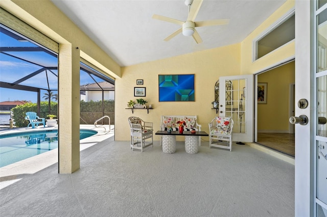 sunroom / solarium with a pool, vaulted ceiling, and a ceiling fan