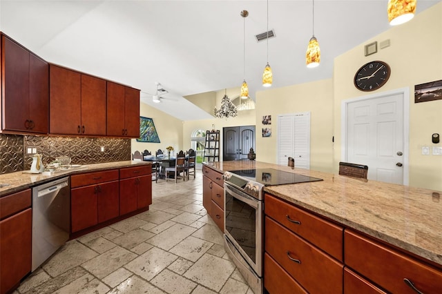 kitchen featuring decorative light fixtures, stone tile flooring, visible vents, decorative backsplash, and appliances with stainless steel finishes