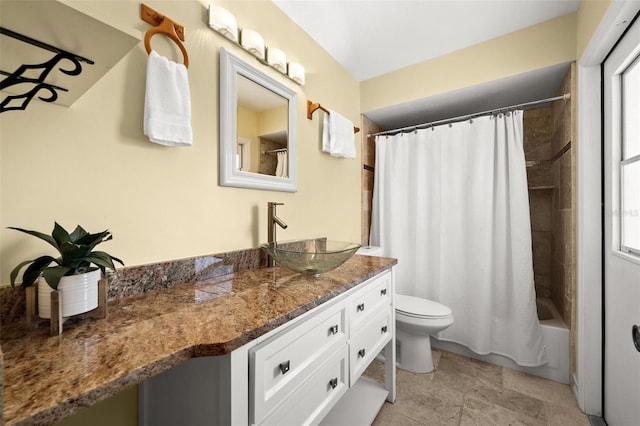 bathroom with shower / tub combo, vanity, and toilet