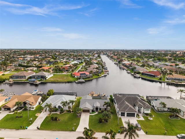 bird's eye view with a water view and a residential view