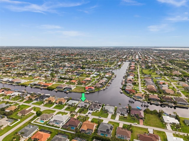 drone / aerial view with a residential view and a water view