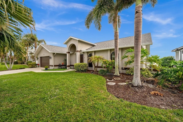 view of front of house featuring driveway, stucco siding, roof with shingles, an attached garage, and a front yard