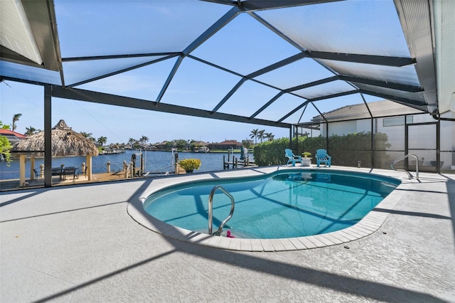 pool with a patio area, a gazebo, a water view, and a lanai