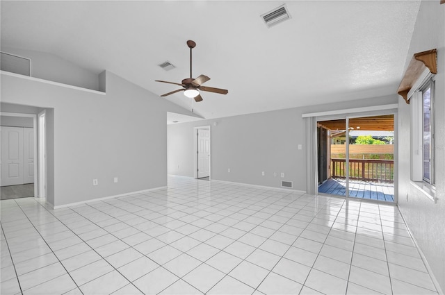 tiled spare room with ceiling fan and lofted ceiling