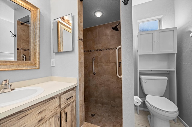 bathroom featuring toilet, vanity, tile patterned floors, and walk in shower