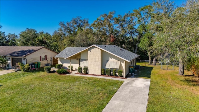 view of front of home featuring a front yard and cooling unit