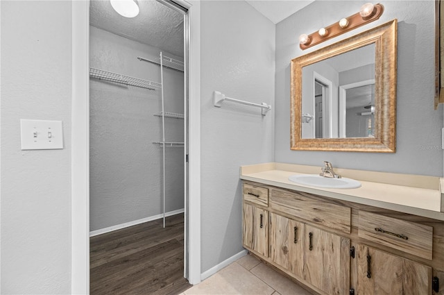 bathroom with vanity and tile patterned floors