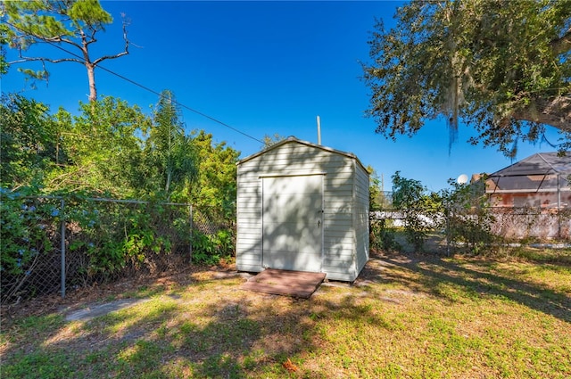 view of outbuilding with a lawn