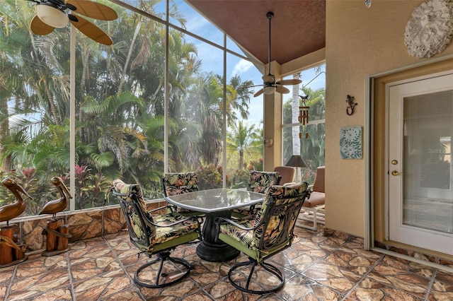 sunroom / solarium with ceiling fan