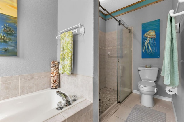 bathroom featuring tile patterned flooring, a textured ceiling, separate shower and tub, and toilet