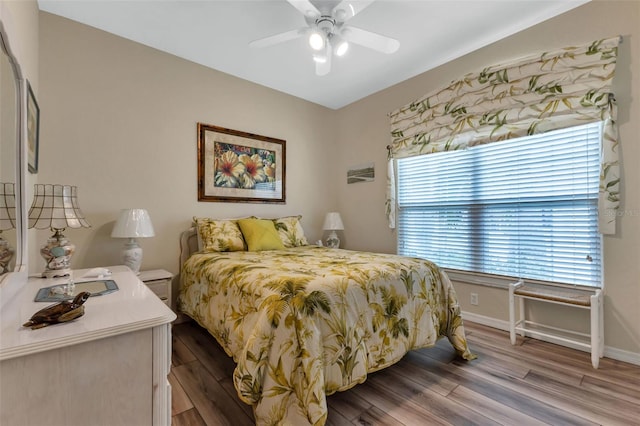 bedroom featuring light hardwood / wood-style floors and ceiling fan