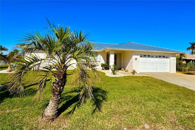 view of front facade with a front yard and a garage