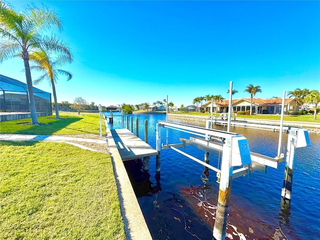 dock area with a lanai, a lawn, and a water view