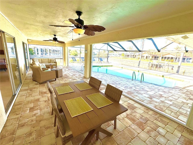 view of patio / terrace featuring an outdoor hangout area, glass enclosure, and an indoor pool