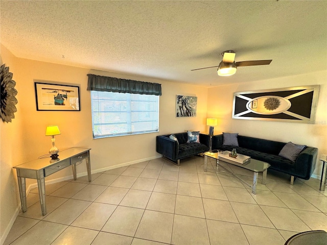 living room featuring light tile patterned floors, a textured ceiling, and ceiling fan