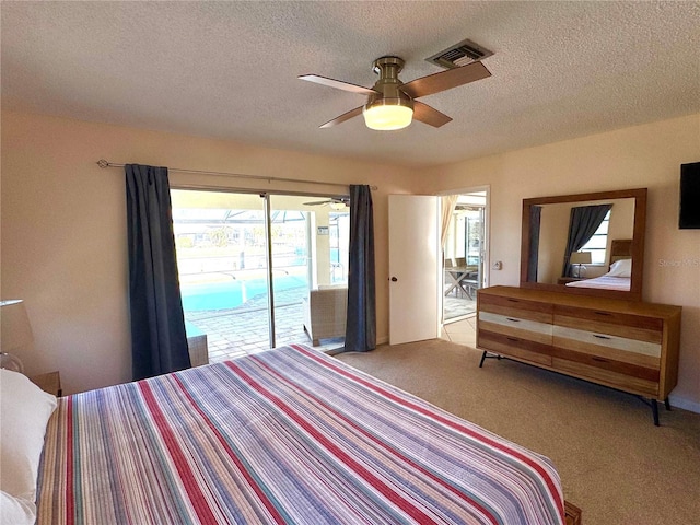 bedroom featuring access to outside, ceiling fan, light carpet, and a textured ceiling