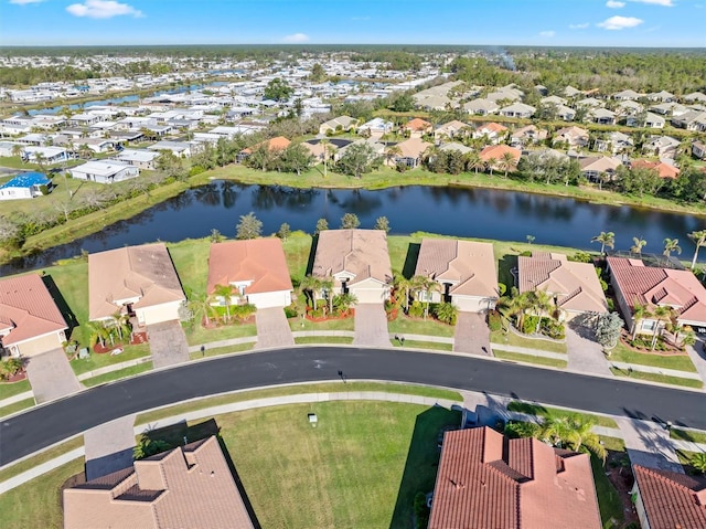 drone / aerial view with a water view