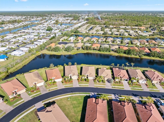 aerial view with a residential view and a water view