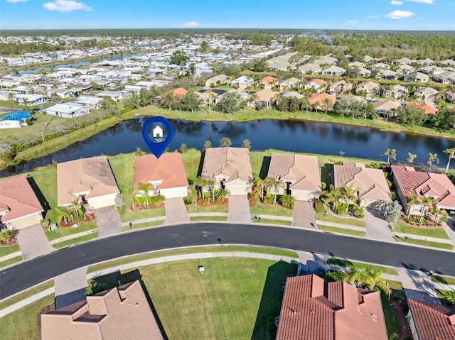 aerial view featuring a residential view and a water view