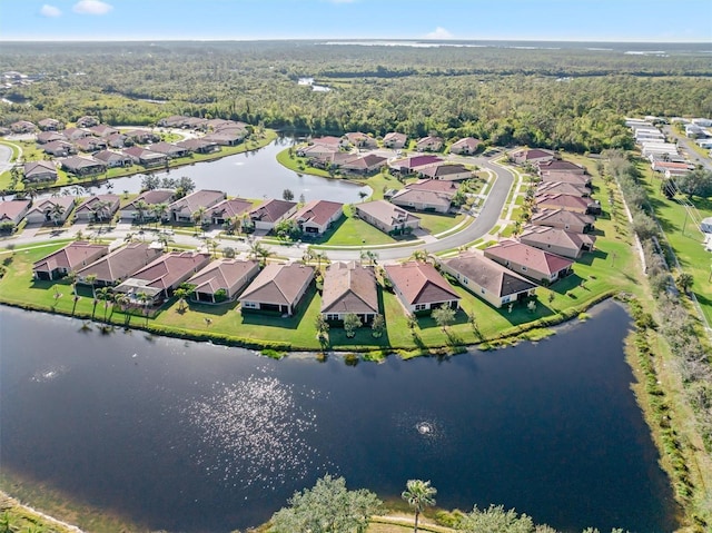 birds eye view of property with a residential view and a water view