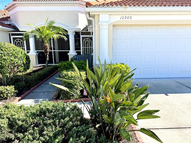 view of exterior entry featuring a garage