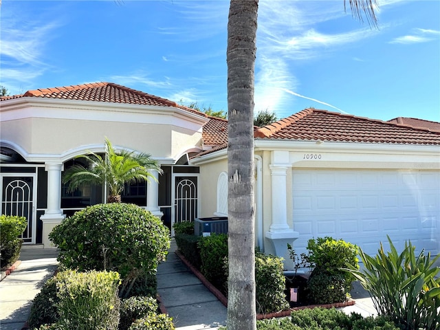 mediterranean / spanish house featuring a garage