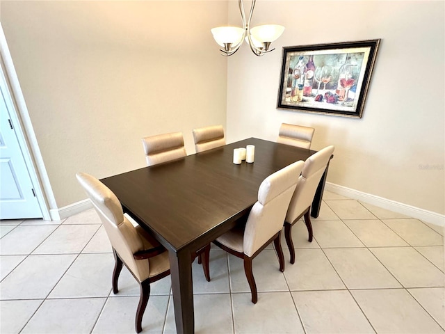 dining space featuring a notable chandelier and light tile patterned flooring